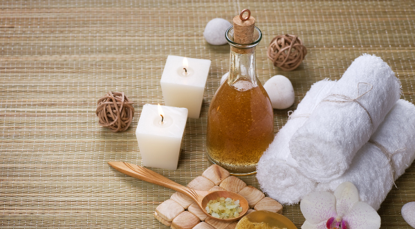 Picture of a pamper package, with things such as oils and candles.